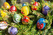 Painted Easter eggs, Easter fountain decorated with colorful Easter eggs in Ebermannstadt on the market square in Franconian Switzerland, Bavaria, Germany