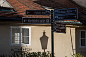 Signpost to Charles Bridge and other landmarks, Prague, Czech Republic