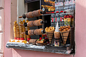 Trdelink's traditional luggage, baked on sticks over an open fire, Prague, Czech Republic