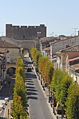 View from the Porte Saint-Antoine, part of the walkable city fortifications of Aigues Mortes, towards Boulevard Gambetta, Aigues-Mortes, Camargue, Occitania, France