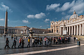People queue in front of St. Peter's Basilica and Vatican Obelisk, Rome, Lazio, Italy, Europe