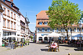 Market square with cafes and a view of Marktstrasse in Bad Bergzabern, Rhineland-Palatinate, Germany
