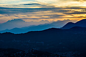 Mountain ranges in the haze, sunset, view from Monte Brè, Lugano, Lake Lugano, Lago di Lugano, Ticino, Switzerland
