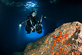 Divers in Green Cave, Vis Island, Mediterranean Sea, Croatia
