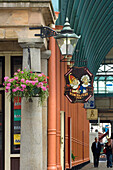 Punch and Judy sign and hanging basket, Covent Garden Market, London