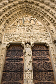 Portal of the Last Judgement and carved stone details on the front of Notre Dame