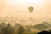 Hot air balloon in the air above the plain of temples in Mandalay, Myanmar