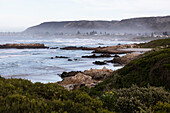 View over a sandy beach and rock formations on the Atlantic coastline, South Africa