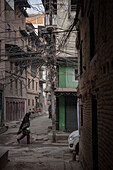 Person in the narrow streets at Durbar Square, wild wiring, Patan, Laitpur, Nepal, Himalayas, Asia