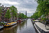 Prinsengracht with houseboats, Westerkerk, Protestant church behind, Amsterdam, North Holland, Netherlands