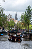 Prinsengracht with houseboats, Westerkerk, Protestant church behind, Amsterdam, North Holland, Netherlands