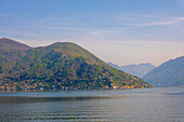 Alpine Lake Lugano with Mountain in a Sunny Day in Morcote, Ticino, Switzerland.