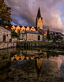 Cathedral and Imperial Palace in Paderborn, reflected in the Dielenpader spring basin, North Rhine-Westphalia, Germany