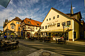 Historic buildings and outdoor dining at the market square of Bad Kissingen, Bavaria, Germany