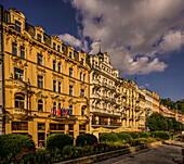 Historic buildings opposite the Mill Fountain Colonnade in the spa district of Karlovy Vary (Karlovy Vary), Czech Republic