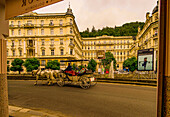 Carriage ride on the waterfront in front of the Grandhotel Pupp in Karlsbad (Karlovy Vary), Czech Republic