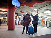 Women looking at the timetable screen,Bus station,Donostia,San Sebastian,Gipuzkoa,Basque Country,Spain,Europe