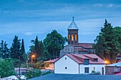 Georgia,Kakheti Area,Telavi,hilltop church,dusk.