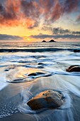 The Brison Rocks captured at sunset from the beach at Porth Nanven near St Just in the far west of Cornwall.