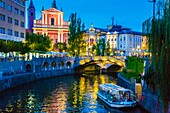 Ljubljanica river,Triple Bridge and the Franciscan Church of the Annunciation. Ljubljana,Slovenia,Europe.