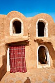 The northern Sahara ghorfa storage graneries of the traditional Berber mud brick fortified Ksar of Hedada or Hadada,near Tetouin,Tunisia,the setting of Mos Espa's Slave Quarters in Star Wars: Episode I The Phantom Menace.