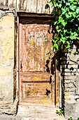 Travel landmark with old door carving in downtown of Tbilisi, Georgia