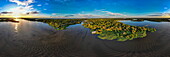 Panoramic aerial view of riverboat MV Dorinha (a traditional Amazon river steamer) tied to flooded trees in river landscape, near Manaus, Amazon, Brazil, South America