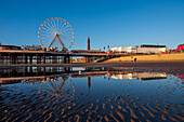 Blackpool beach with mirror reflections of the ferris wheel and Blackpool Tower, Blackpool, Lancashire, England, United Kingdom, Europe