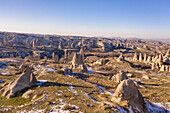 Turkey, Cappadocia, Landscape with rock formations near Goreme in Winter