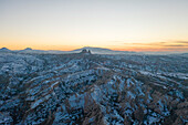 Turkey, Cappadocia, Landscape with Castle mountain covered with snow
