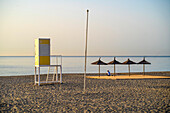 Spain, Malaga, Fuengirola, Empty beach and lifeguard hut