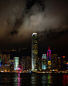 View of illuminated skyscrapers along the waterfront financial district in Hong Kong