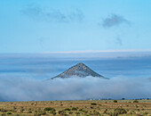 USA, New Mexico, Santa Fe, Clouds covering landscape in Cerrillos Hills State Park