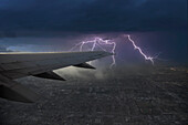 USA, New York, New York, Thunderstorm and lightning seen from airplane