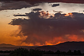 Usa, Idaho, Bellevue, Storm clouds over landscape at sunset