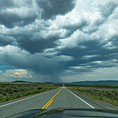 USA, Idaho, Fairfield, Highway under stormy sky