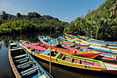 Tourist tour boats on Pute River in karst limestone region, Rammang-Rammang, Maros, South Sulawesi, Indonesia, Southeast Asia, Asia