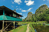 Stilt house, fish pond, limestone peaks, Rammang village, karst region, Rammang-Rammang, Maros, South Sulawesi, Indonesia, Southeast Asia, Asia