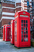 Traditional red metal K6 telephone boxes designed by Sir Giles Gilbert Scott, Holborn, London, England, United Kingdom, Europe