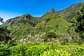 Village of Serra de Agua in the lush vegetation at feet of mountains, Ribeira Brava municipality, Madeira island, Portugal, Atlantic, Europe