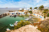 View over fishing harbour with boats and colourful boat houses, Mandrakia, Milos, Cyclades, Aegean Sea, Greek Islands, Greece, Europe