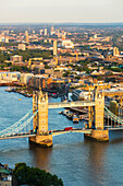 Red London bus crossing Tower Bridge, from above, London, England, United Kingdom, Europe