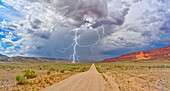 Lightning storm rolling across House Rock Valley Road on the west side of Vermilion Cliffs National Monument, Arizona, United States of America, North America