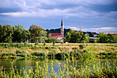 Parish Church of St. Johannes seen from the other bank of the Isar, Dingolfing, Bavaria, Germany