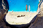 Crowd of tourists sunbathing on the idyllic Shipwreck Beach (Navagio Beach), aerial view, Zakynthos island, Greek Islands, Greece, Europe
