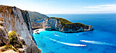 Ferry boats in the turquoise lagoon surrounding the iconic Shipwreck Beach (Navagio Beach), aerial view, Zakynthos, Greek Islands, Greece, Europe