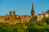 View of New College, The University of Edinburgh, on The Mound, from Princes Street at sunset, Edinburgh, Scotland, United Kingdom, Europe