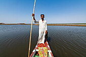 Marsh Arab on his boat, Mesopotamian Marshes, The Ahwar of Southern Iraq, UNESCO World Heritage Site, Iraq, Middle East