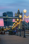Tower Bridge and the Walkie Talkie building (20 Fenchurch Street) at sunset, from Shad Thames, London, England, United Kingdom