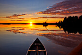 Canada, Quebec, Belleterre. Sunset on Lac des Sables and boat